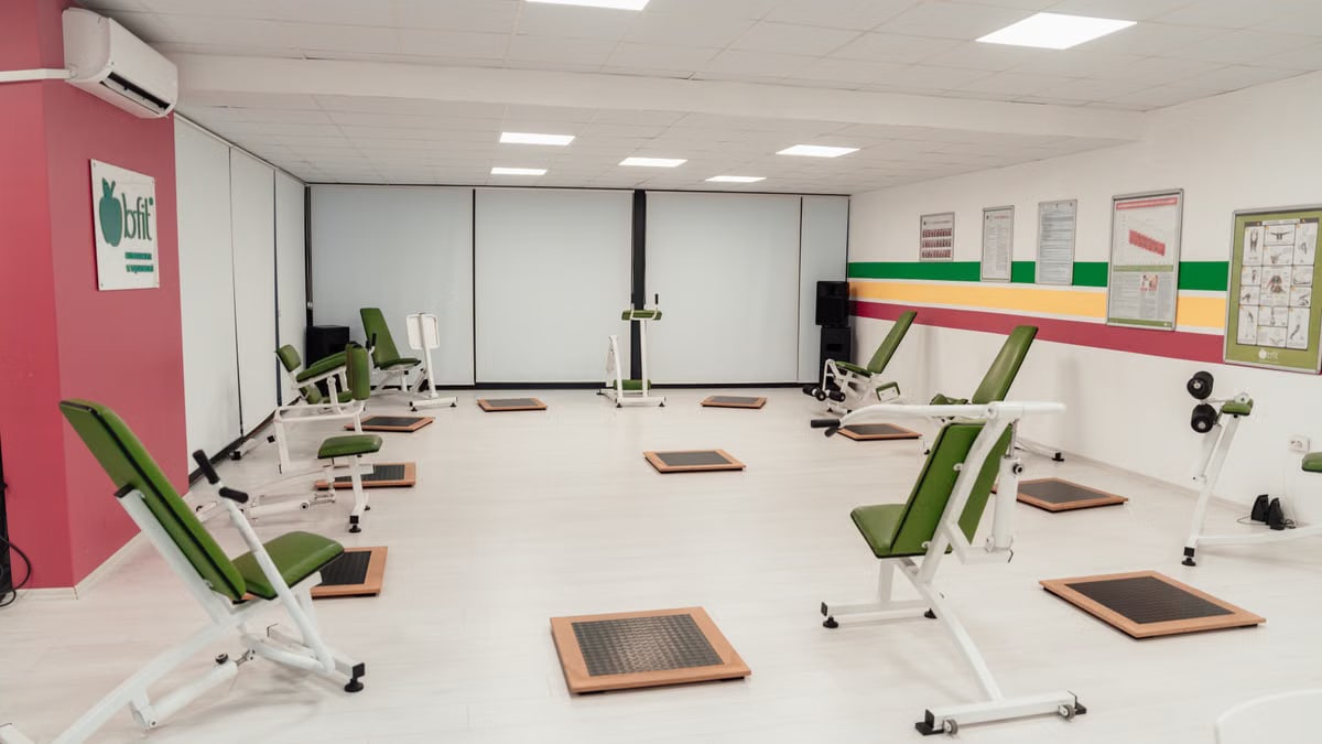 Bright and spacious gym interior featuring modern green exercise machines in Yalova.